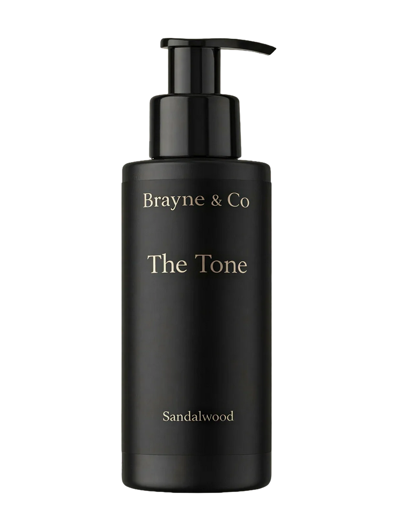 Brayne & Co The Tone — Hydrating Self Tanner for Men in black bottle with pump and sandalwood scent label
